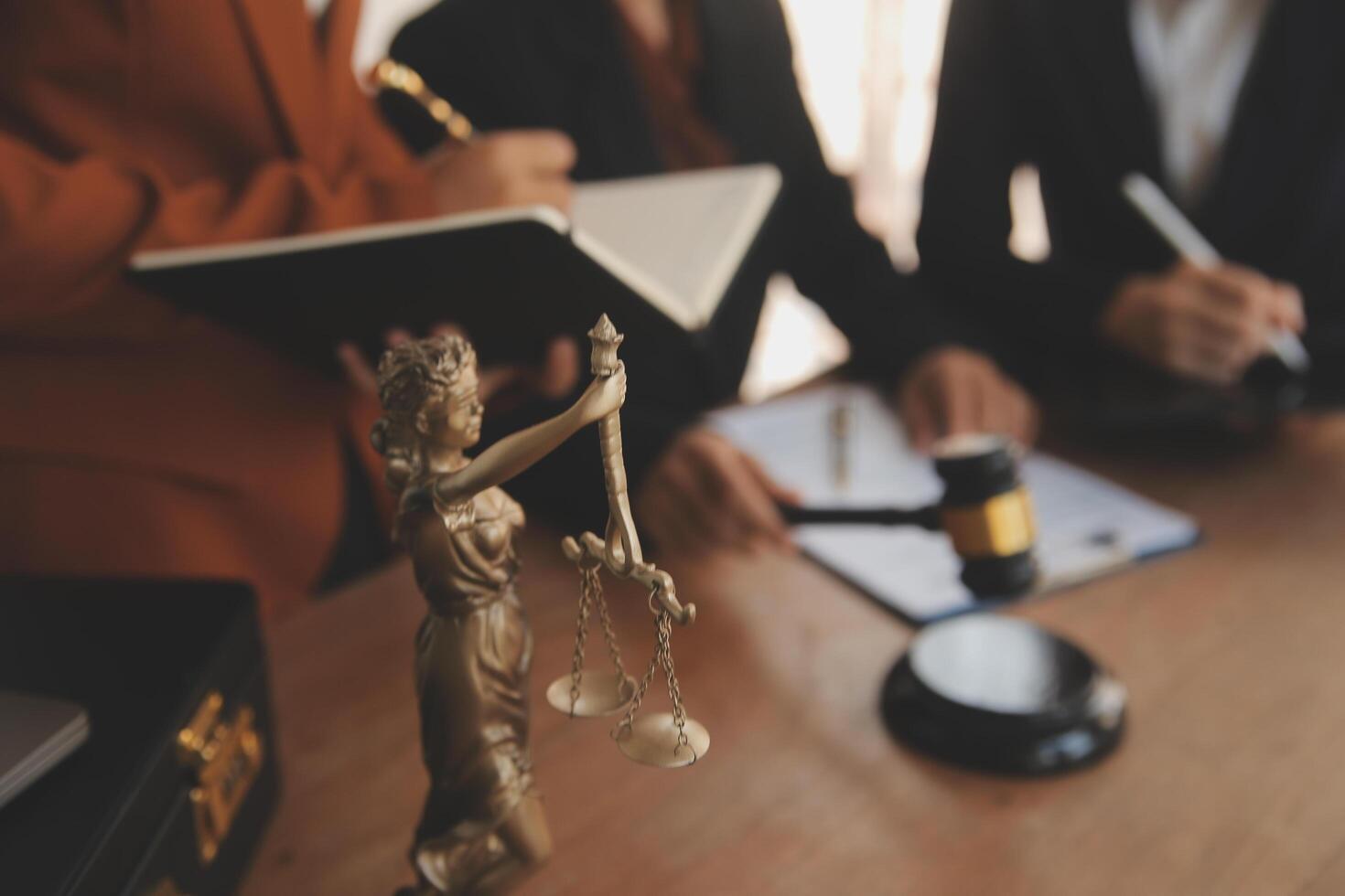 Lawyer, legal advisor, businessman brainstorming information on agreement details Business contracts in legal processing books for accuracy in contract documents. joint financial investment. photo