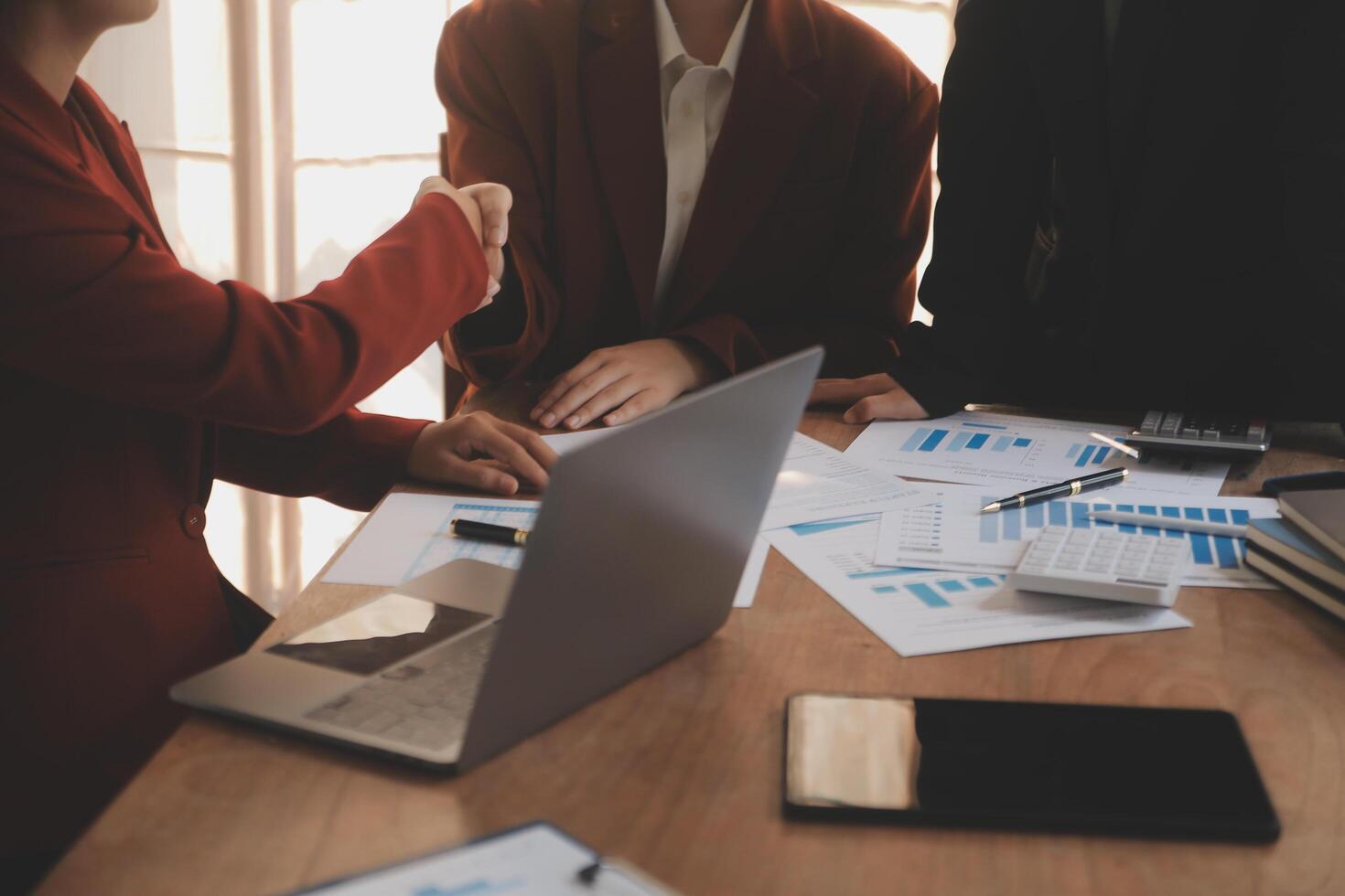 Close up of a team of business people having a meeting to analyze data for a marketing plan. photo