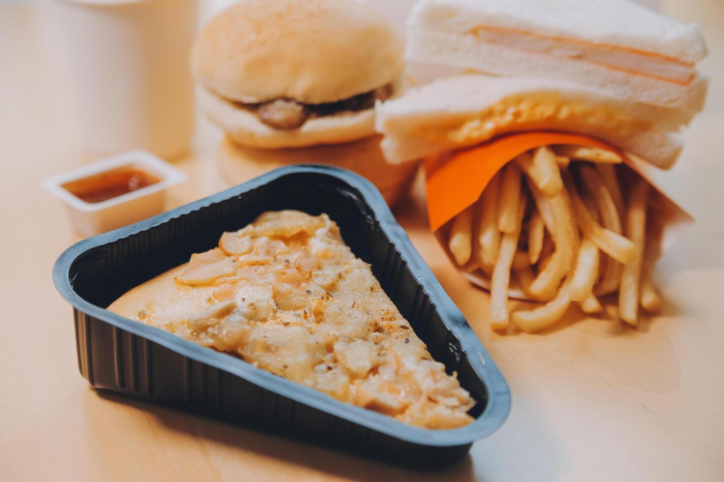 Multiple type of Fast food on table. photo