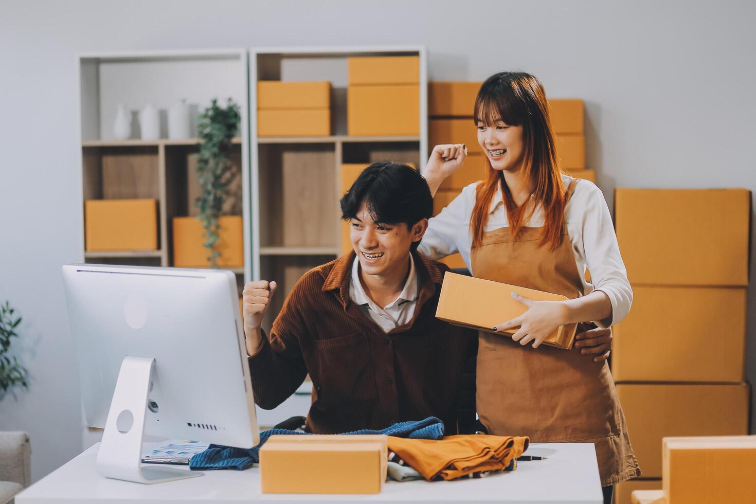 Small business owners couple entrepreneurs working with parcel, e-business, marketing, online shop, sme, entrepreneurs photo