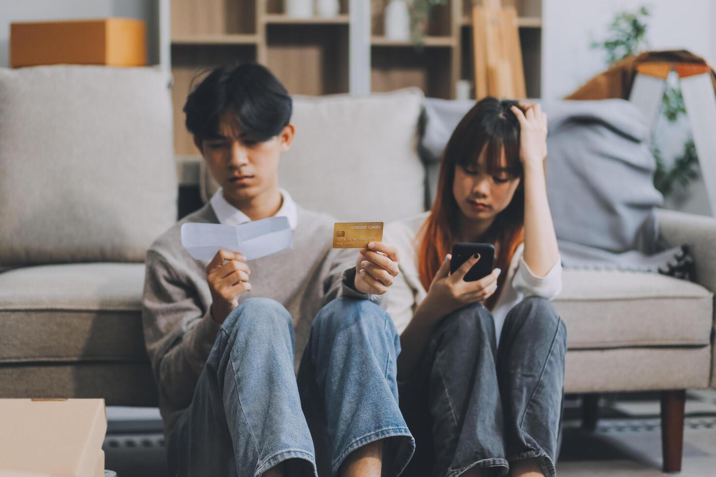 Worried annoyed young husband wife using phone credit card dissatisfied with interrupted wifi internet connection slow bad app work. Angry family couple bank clients unable to pay online check balance photo