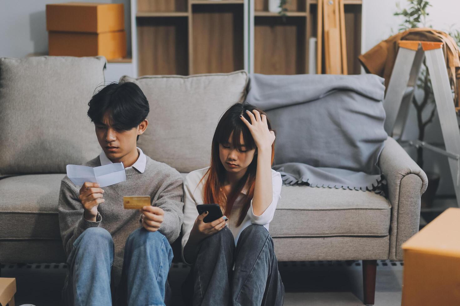 Worried annoyed young husband wife using phone credit card dissatisfied with interrupted wifi internet connection slow bad app work. Angry family couple bank clients unable to pay online check balance photo