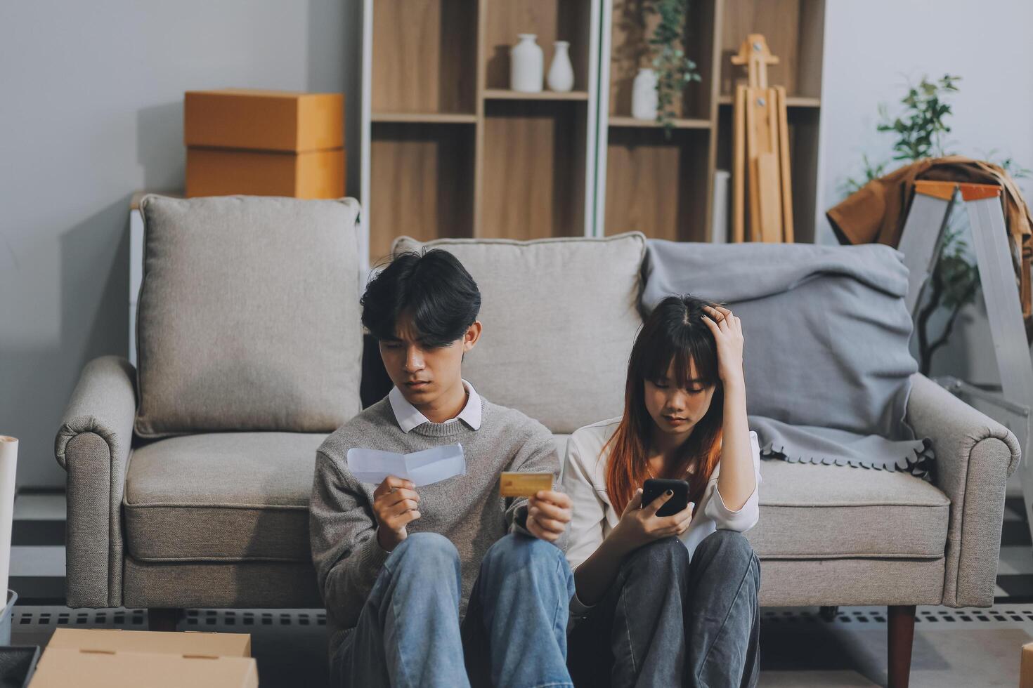 Worried annoyed young husband wife using phone credit card dissatisfied with interrupted wifi internet connection slow bad app work. Angry family couple bank clients unable to pay online check balance photo