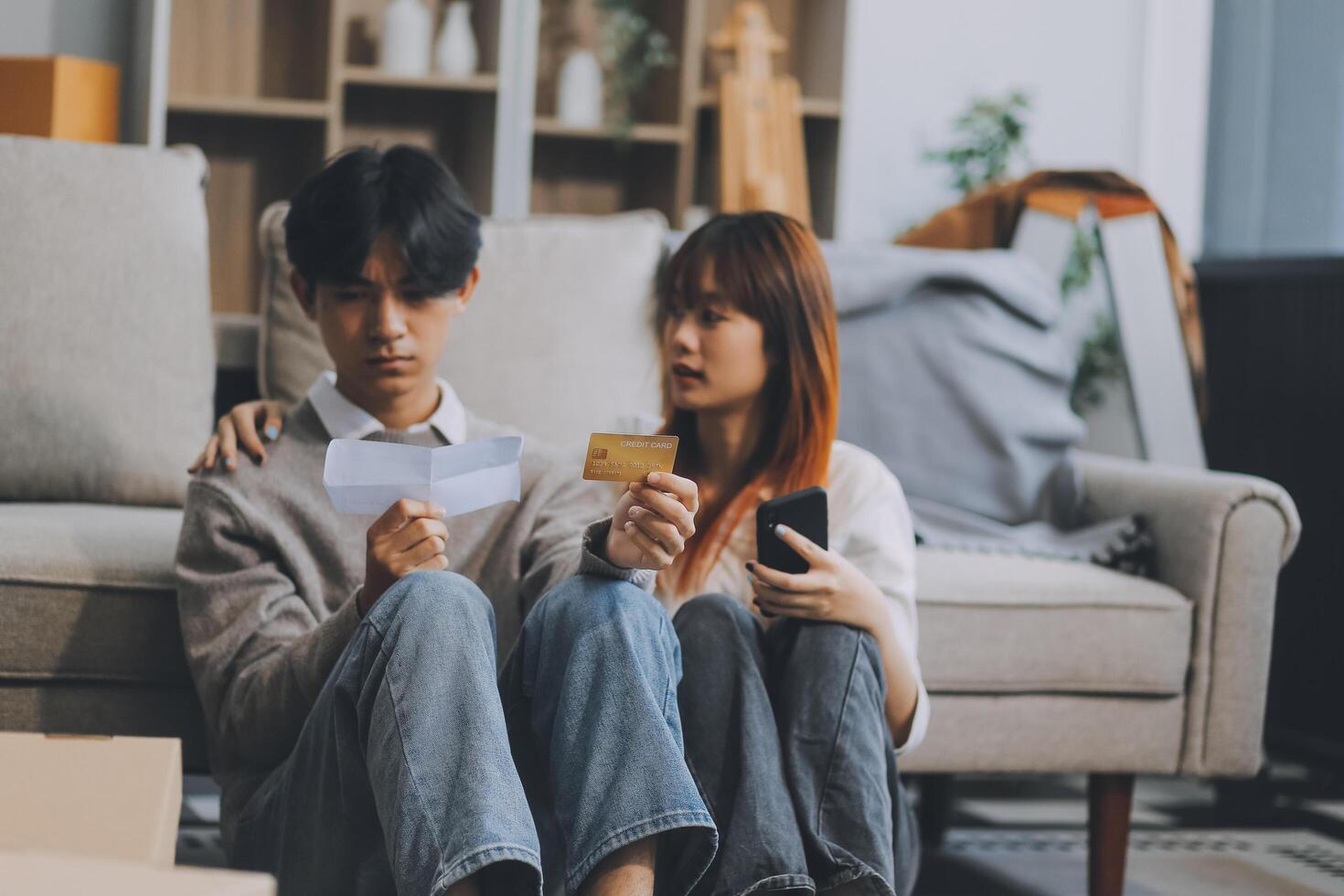 Worried annoyed young husband wife using phone credit card dissatisfied with interrupted wifi internet connection slow bad app work. Angry family couple bank clients unable to pay online check balance photo