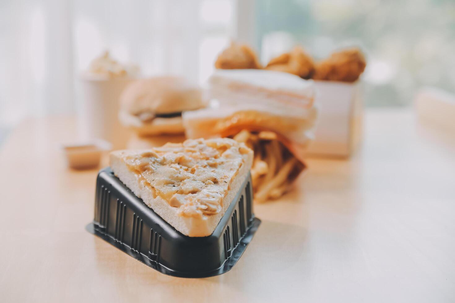 Multiple type of Fast food on table. photo