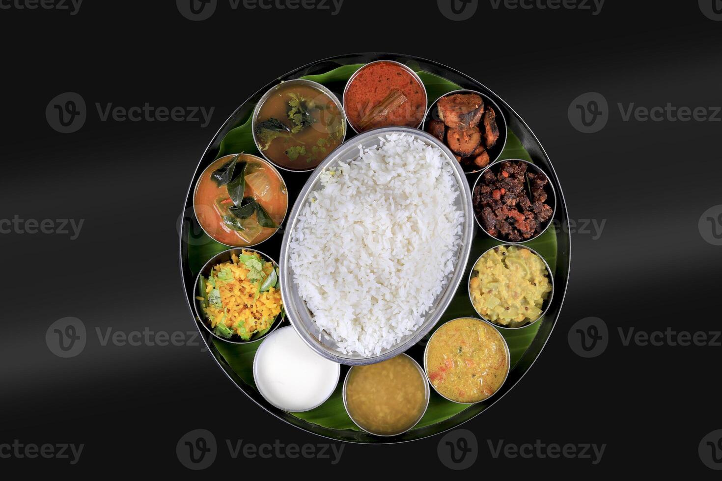 A south indian banana leaf full meals food photo