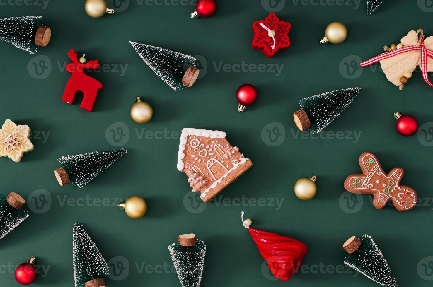 Trendy Christmas pattern made of various winter and Xmas objects on green background. Minimal creative Christmas and New Year concept. Festive holiday pattern backdrop. Christmas aesthetic. Flat lay. photo