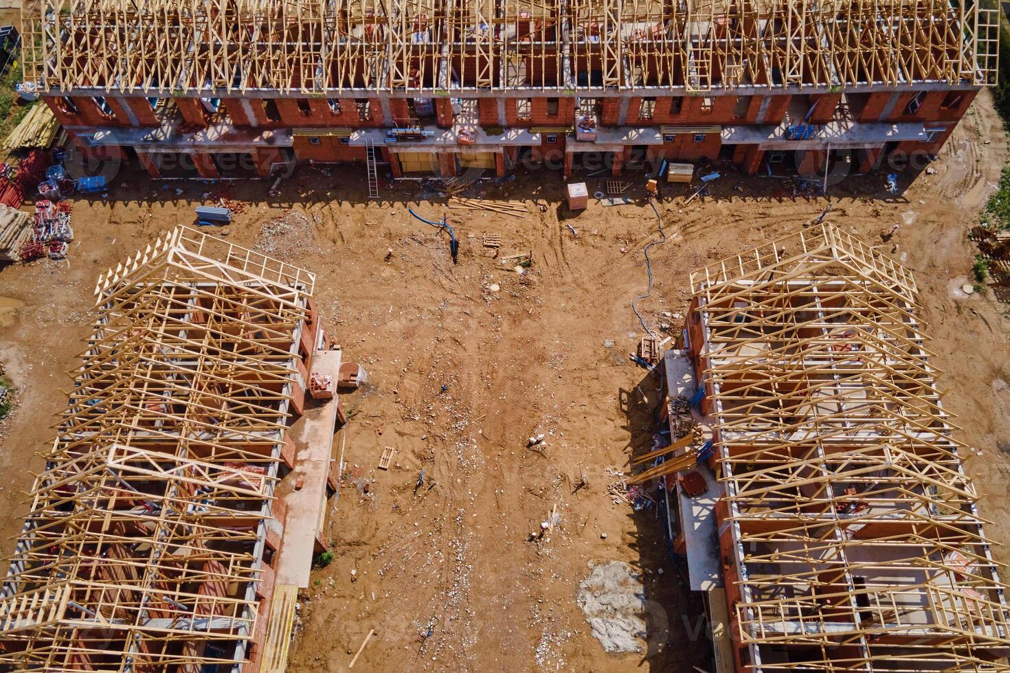 New house under construction, wooden truss system forming roof. Process of building project. photo