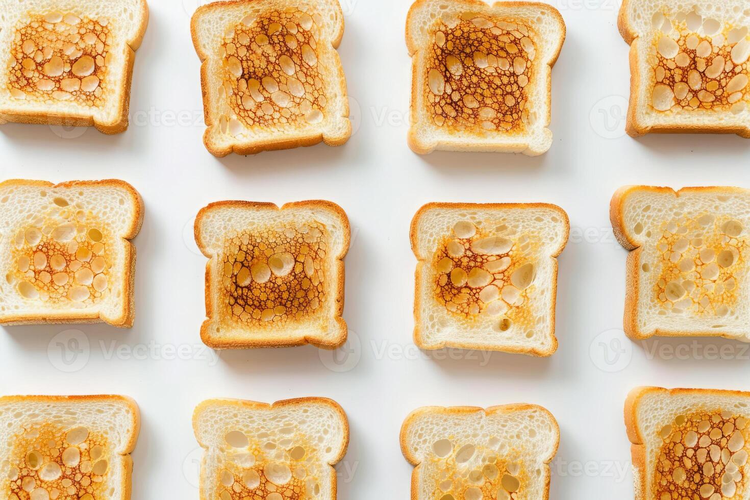 Many slices of toasted bread on white background, top view photo