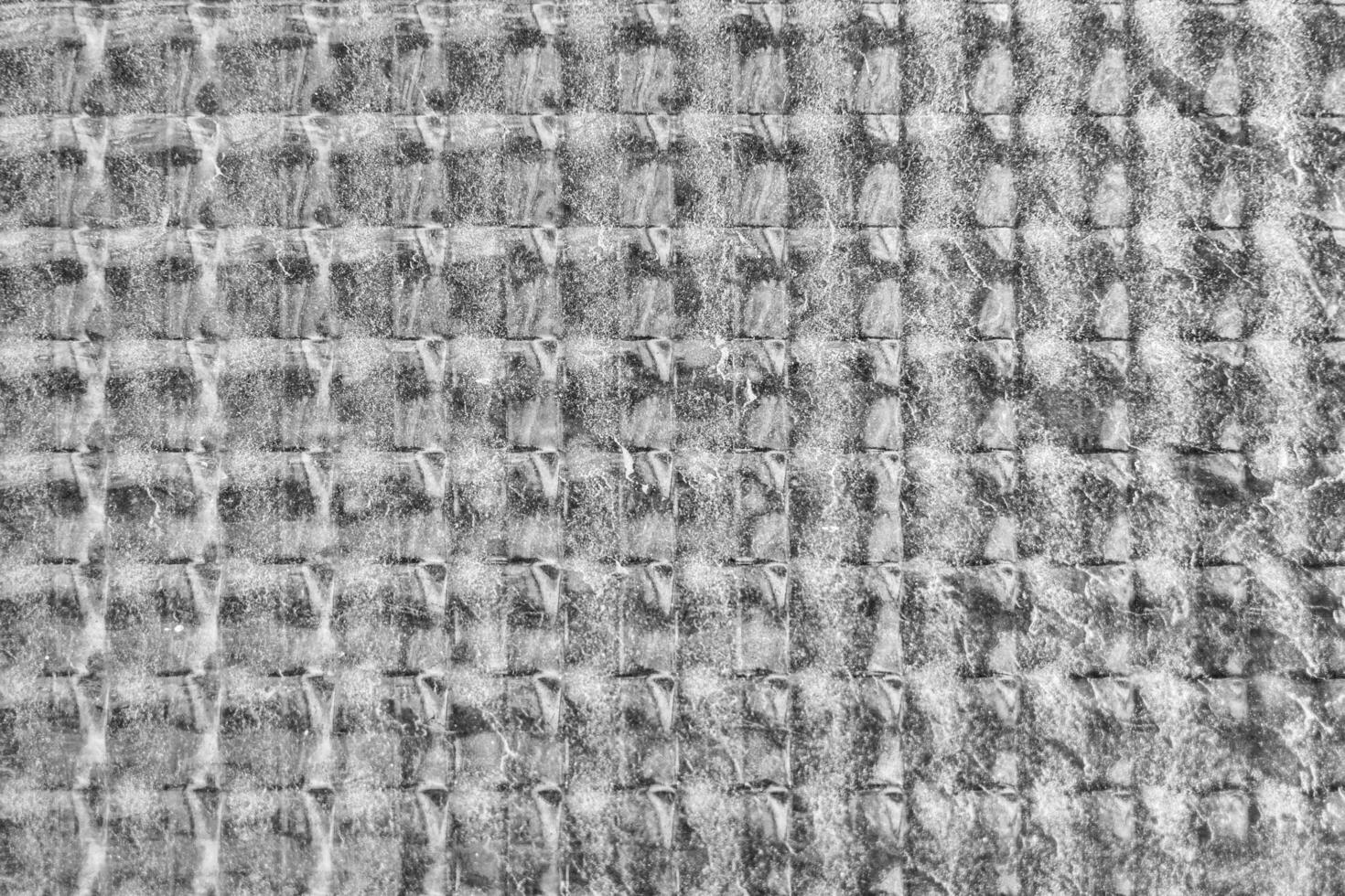 Abstract close-up of a glass window with a textureand graind pattern. photo