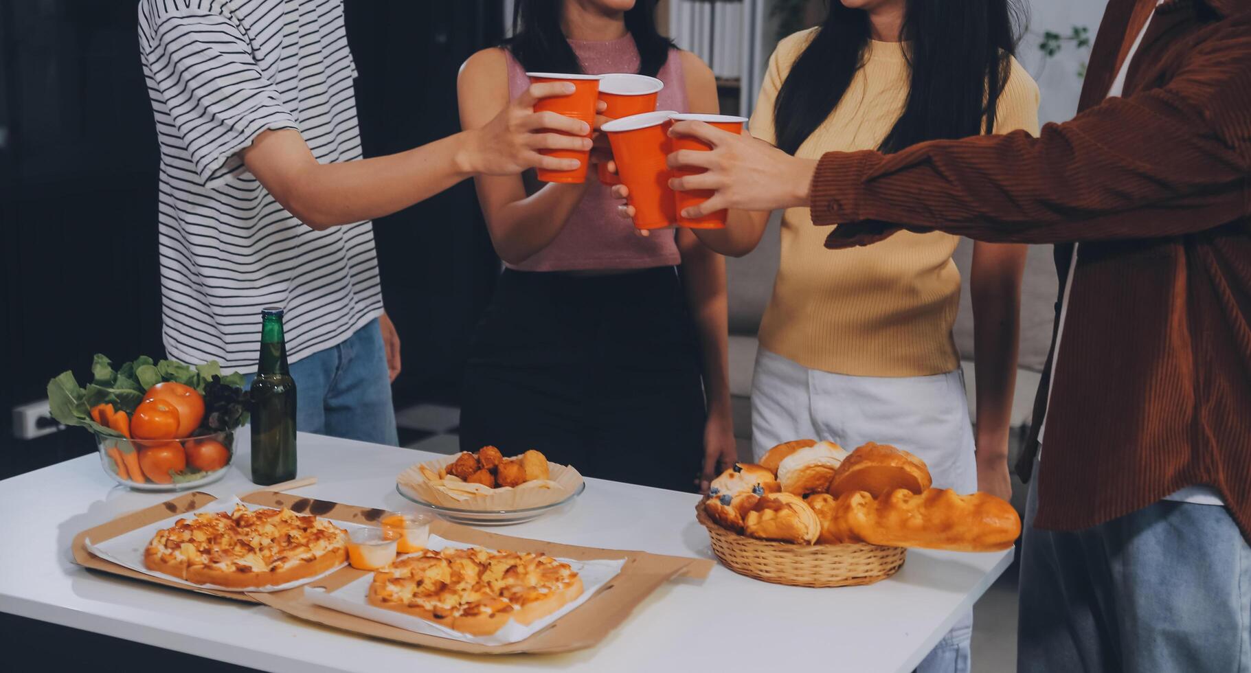 Group of young friends eating pizza.Home party. photo