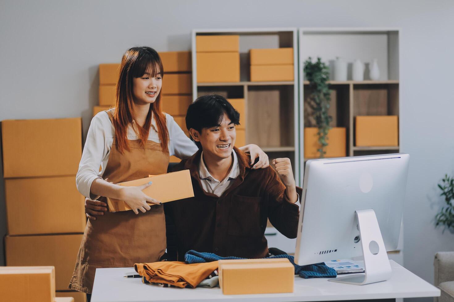 Small business owners couple entrepreneurs working with parcel, e-business, marketing, online shop, sme, entrepreneurs photo