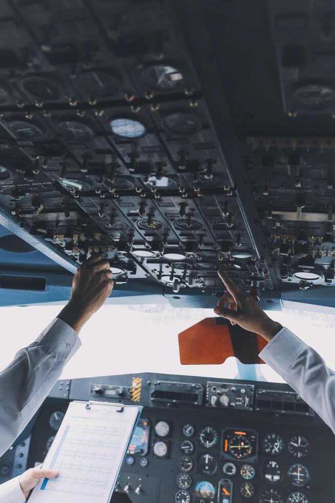 Professional pilot woman in uniform has teamwork meeting for success flight in aviation business. Young female captain instructor sitting in office and working or training commercial airline crew. photo
