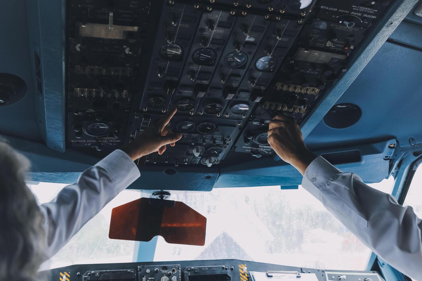 Professional pilot woman in uniform has teamwork meeting for success flight in aviation business. Young female captain instructor sitting in office and working or training commercial airline crew. photo