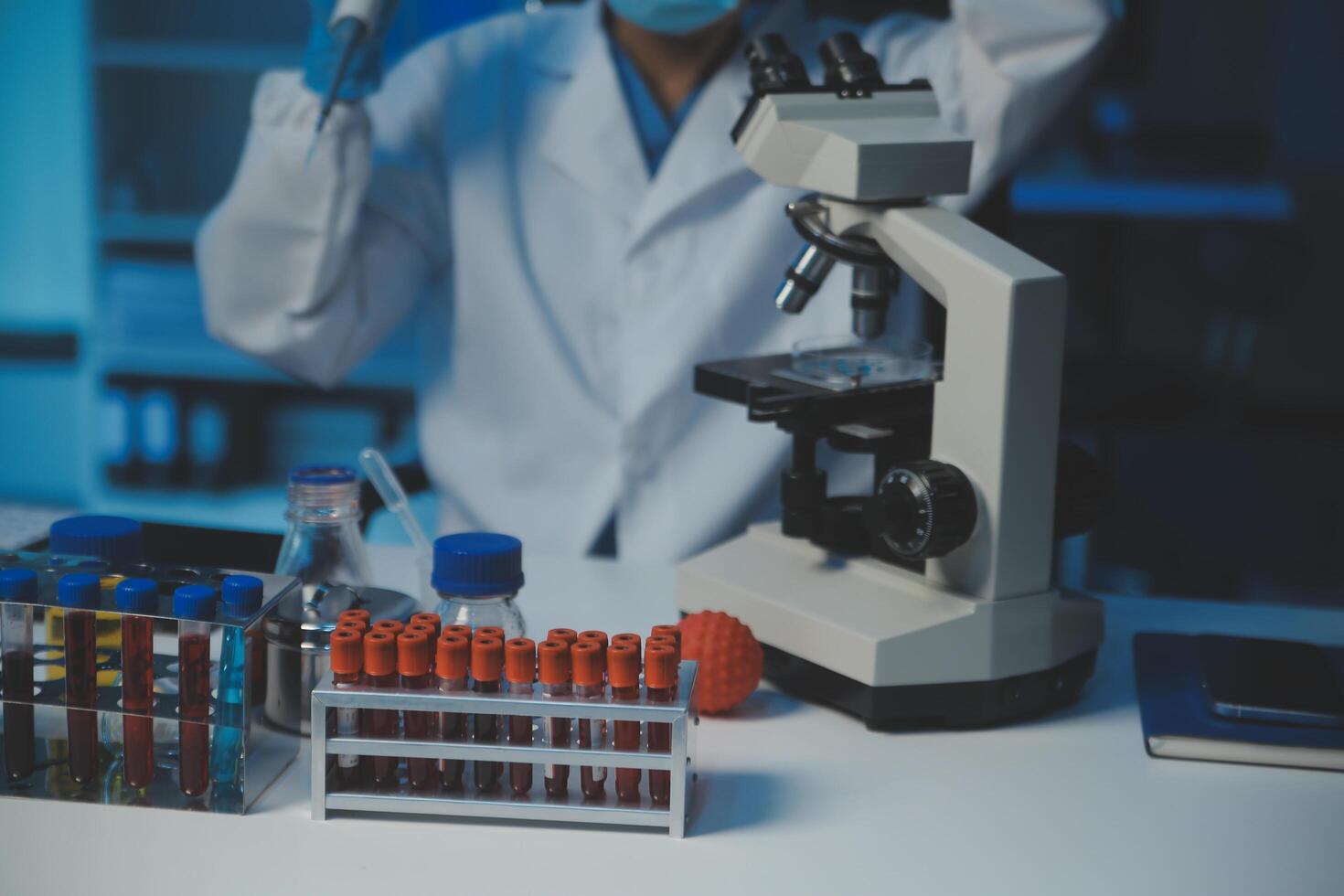 professional chemist woman laboratory using scientific microscope for science research, chemistry scientist with microbiology medicals equipment technology to working with medicine biology experiment photo