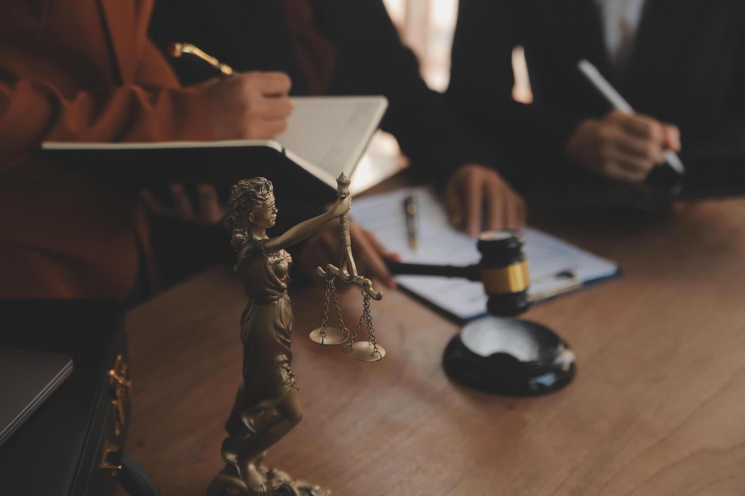 Lawyer, legal advisor, businessman brainstorming information on agreement details Business contracts in legal processing books for accuracy in contract documents. joint financial investment. photo