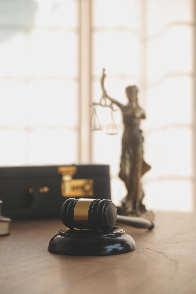 Lawyer, legal advisor, businessman brainstorming information on agreement details Business contracts in legal processing books for accuracy in contract documents. joint financial investment. photo