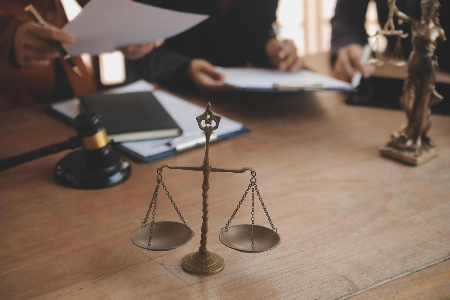 Lawyer, legal advisor, businessman brainstorming information on agreement details Business contracts in legal processing books for accuracy in contract documents. joint financial investment. photo