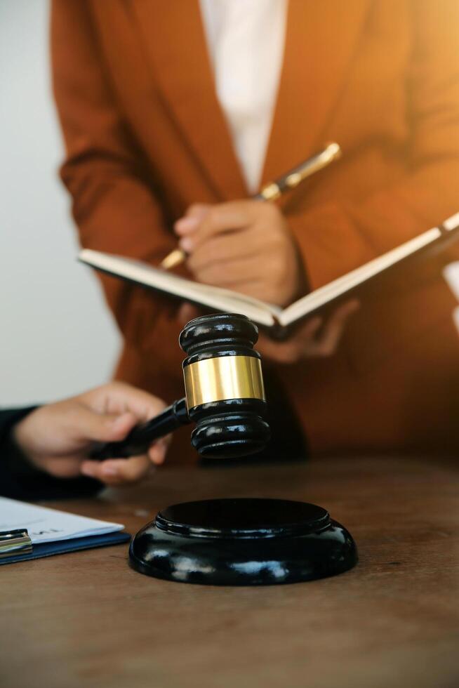 Lawyer, legal advisor, businessman brainstorming information on agreement details Business contracts in legal processing books for accuracy in contract documents. joint financial investment. photo