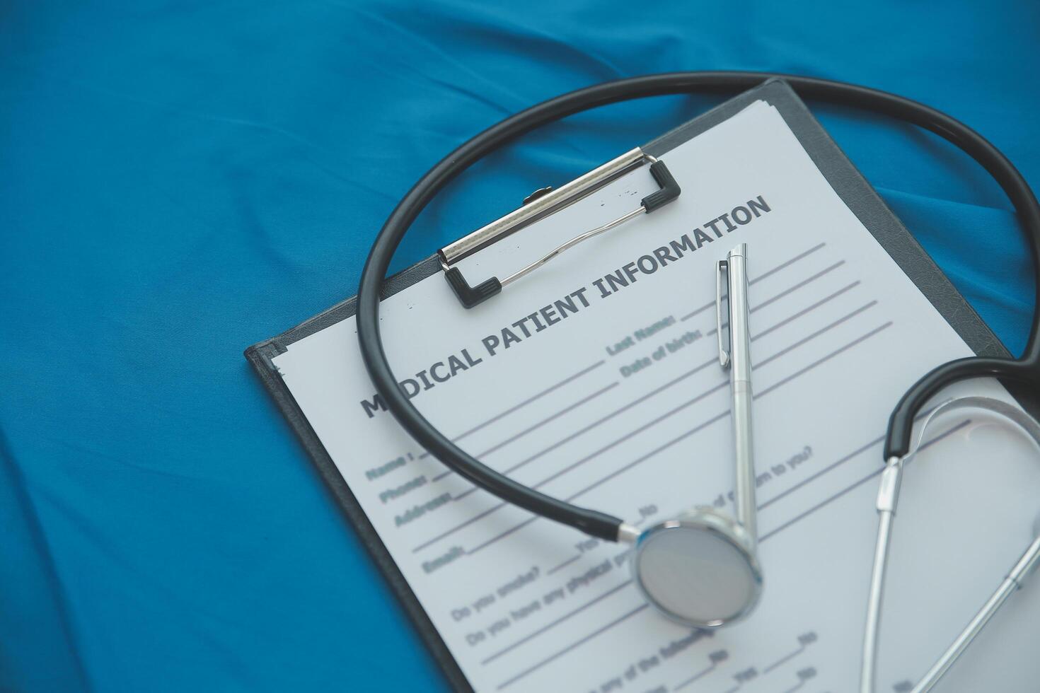 In a hospital setting, the presence of a doctor's physician book and stethoscope carries with it an air of professionalism and dedication to patient care. photo