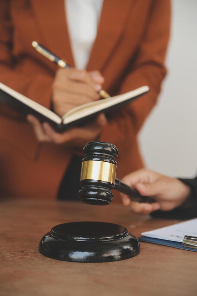 Lawyer, legal advisor, businessman brainstorming information on agreement details Business contracts in legal processing books for accuracy in contract documents. joint financial investment. photo