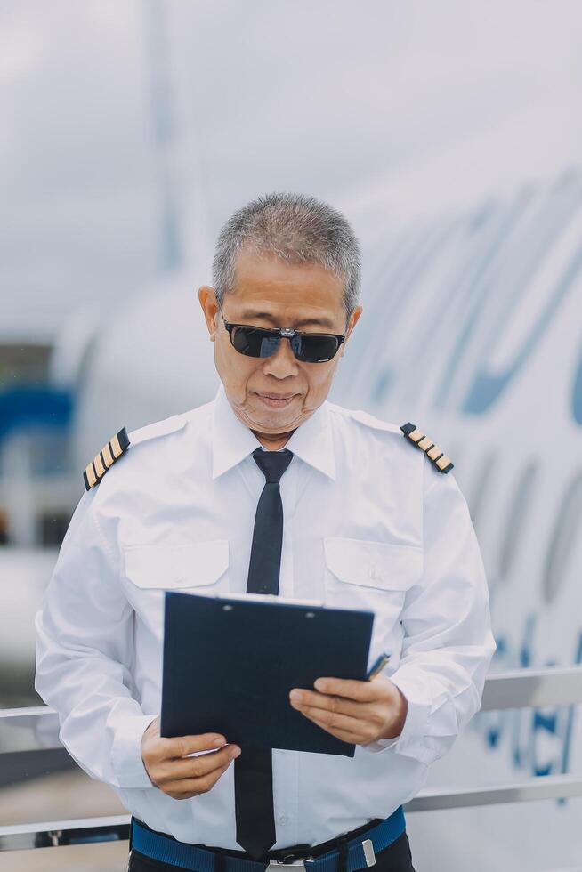 Professional pilot woman in uniform has teamwork meeting for success flight in aviation business. Young female captain instructor sitting in office and working or training commercial airline crew. photo