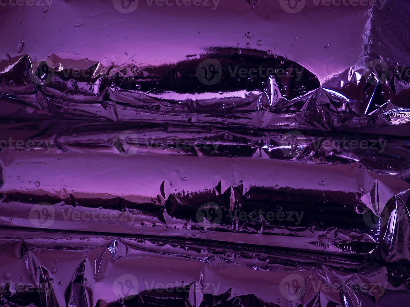Plastic texture in dark purple light at night for abstract background photo