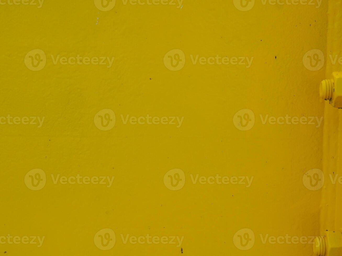 Yellow painted steel texture for a close-up background of a building or construction. photo