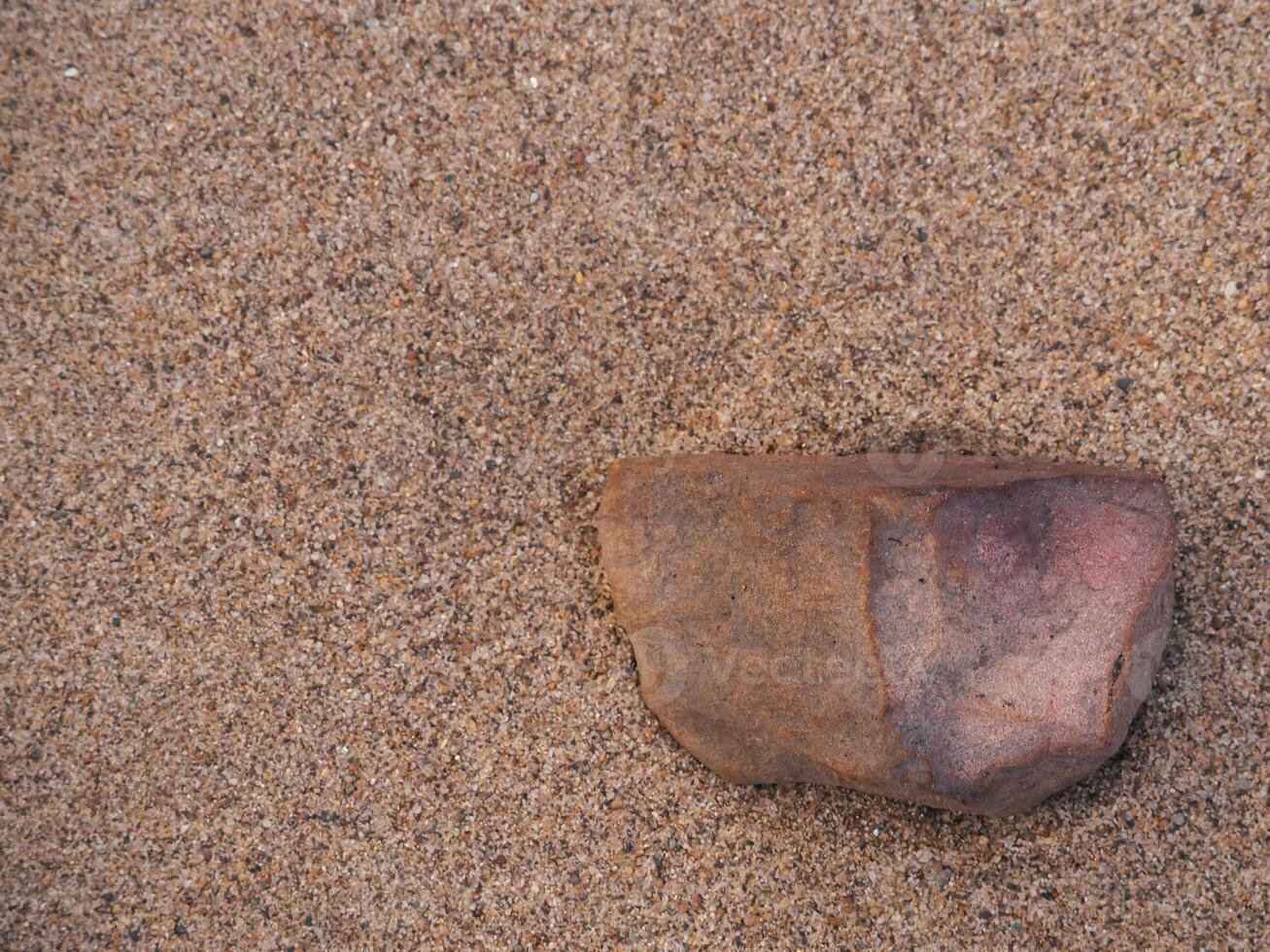 Brown rocks on sand for product display or background ,copy space photo