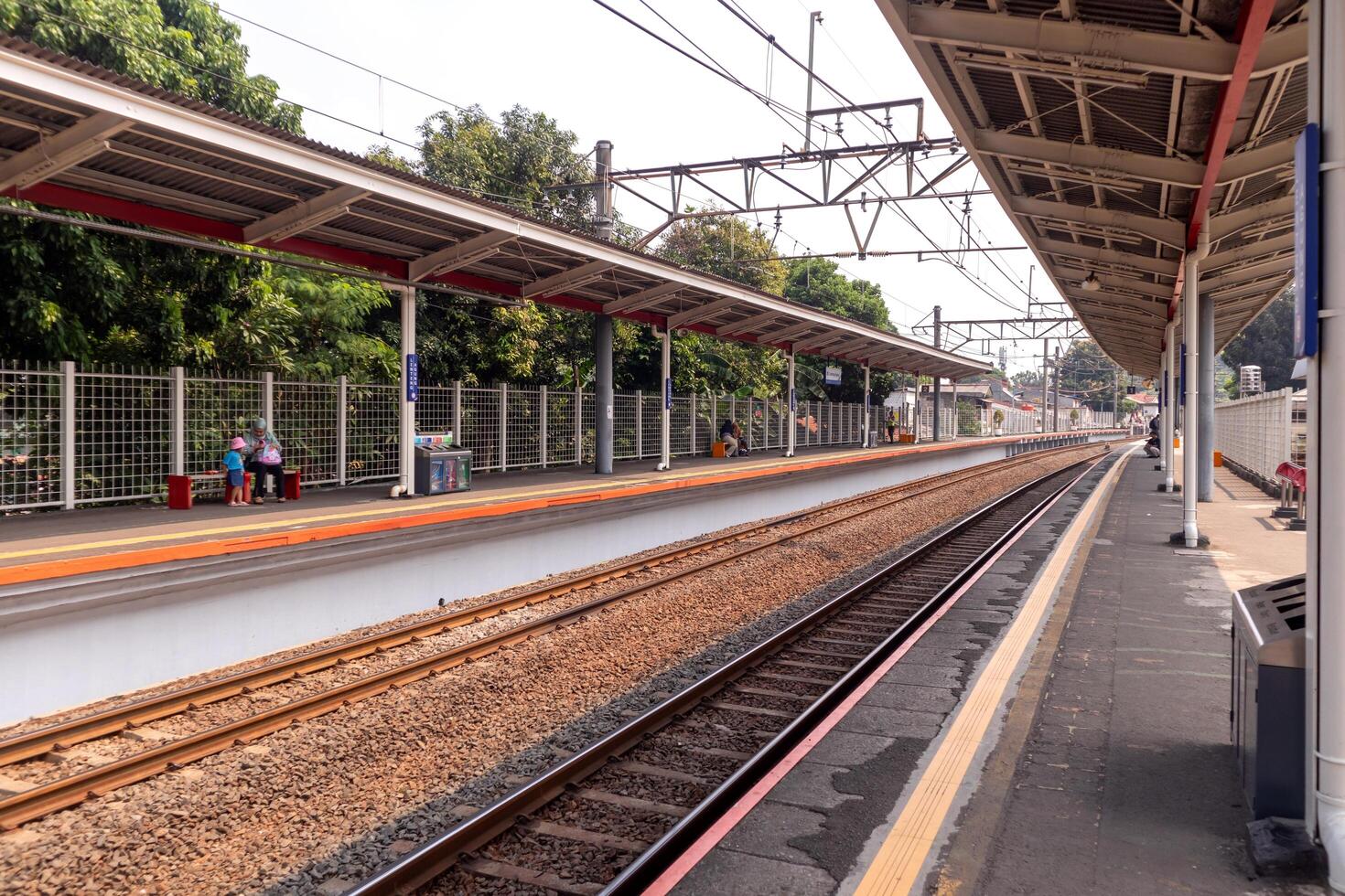 Jakarta, Indonesia, 2024 - A commuter line train platform in Jakarta. The commuter line train stop at the Lenteng Agung station. Mass public transportation in Jakarta. photo