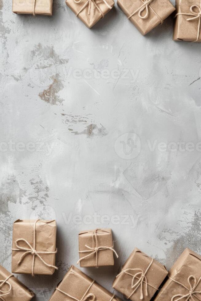 Wrapped parcels arranged on a smooth gray surface for a festive occasion, copy space. photo