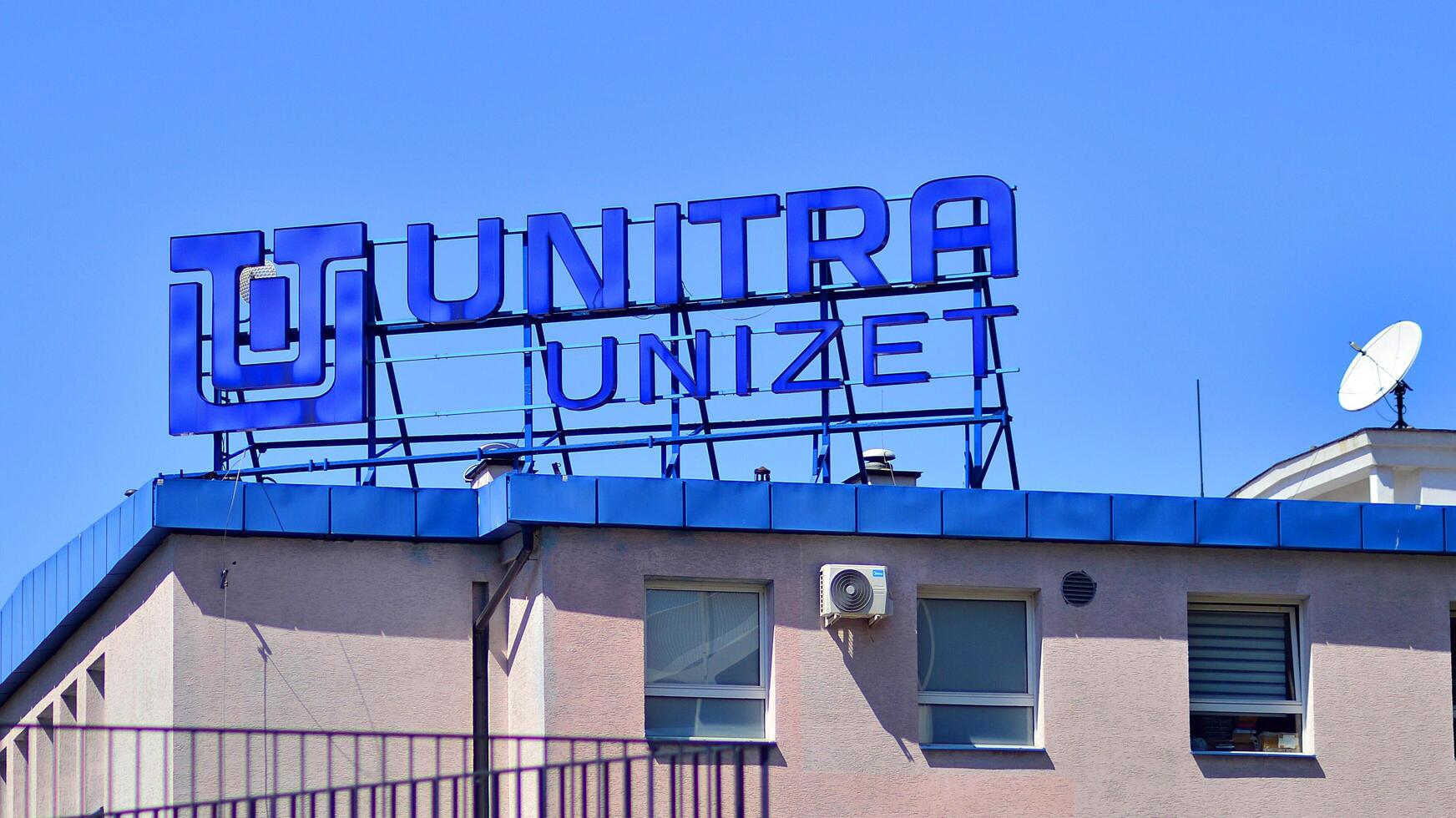 Warsaw, Poland. 31 July 2024. Wola business district in the city center with office centers and modern buildings. Urban landscape. Company signboard Unitra Unizet. photo