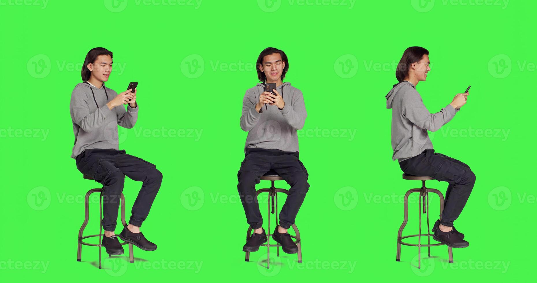 Adult typing text messages on phone while sitting on chair, browsing social media app for messaging on smartphone. Young trendy person using device to communicate with people. photo