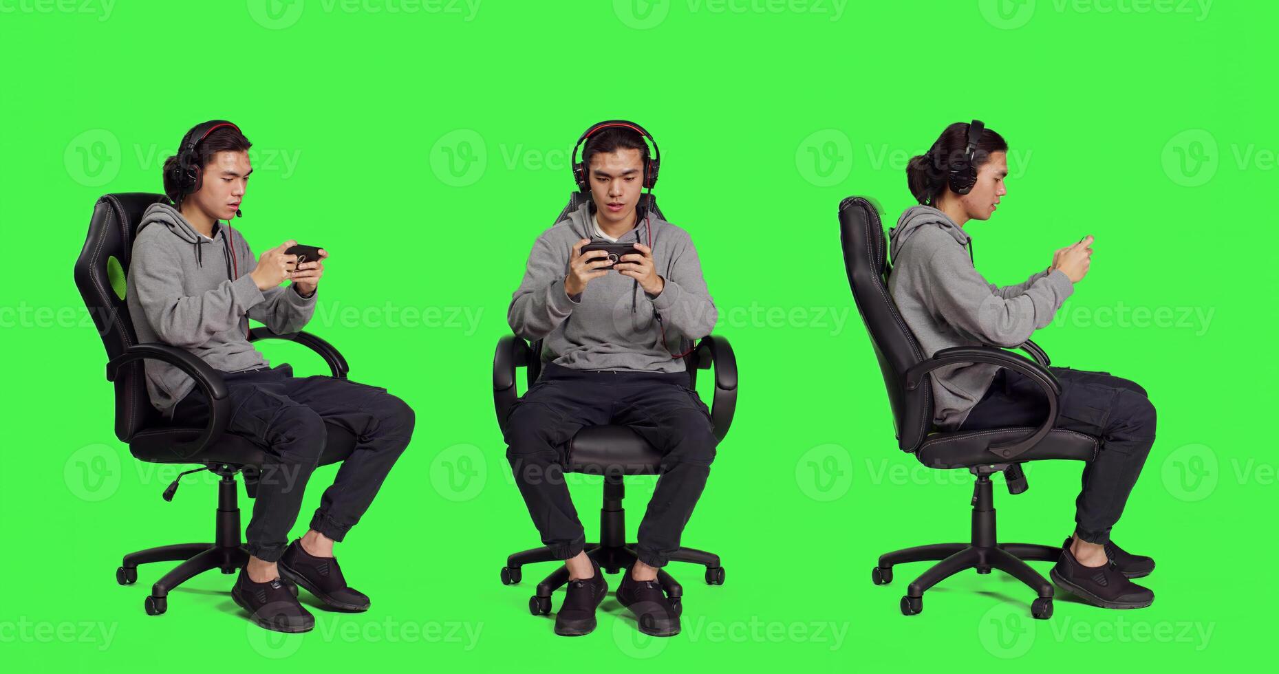 Asian person playing mobile games over full body greenscreen, holding smartphone to play online rpg contest. Modern gamer using phone gadget to have fun with new gameplay on chair. photo