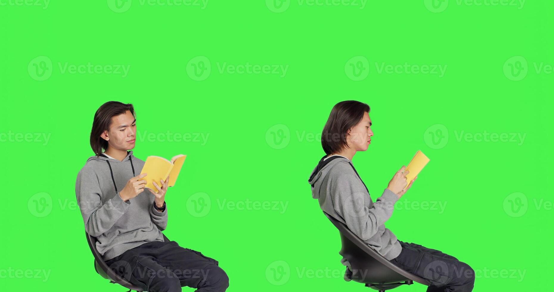 Asian person reading literature book over greenscreen backdrop, enjoying lecture while he sits on chair. Young adult reads fiction novel, being interested in old school hobbies. photo