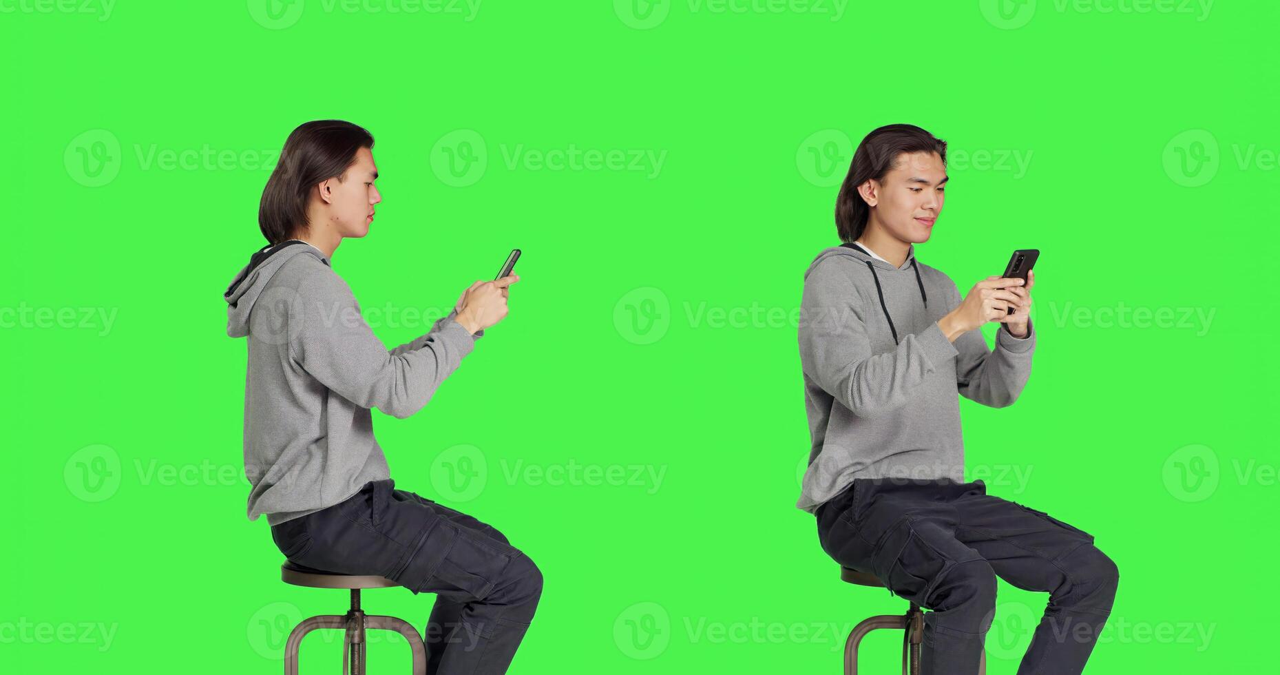 Person sending text messages on phone while sitting on chair, browsing social media for messaging on smartphone app. Young modern guy using gadget to communicate with friends. photo
