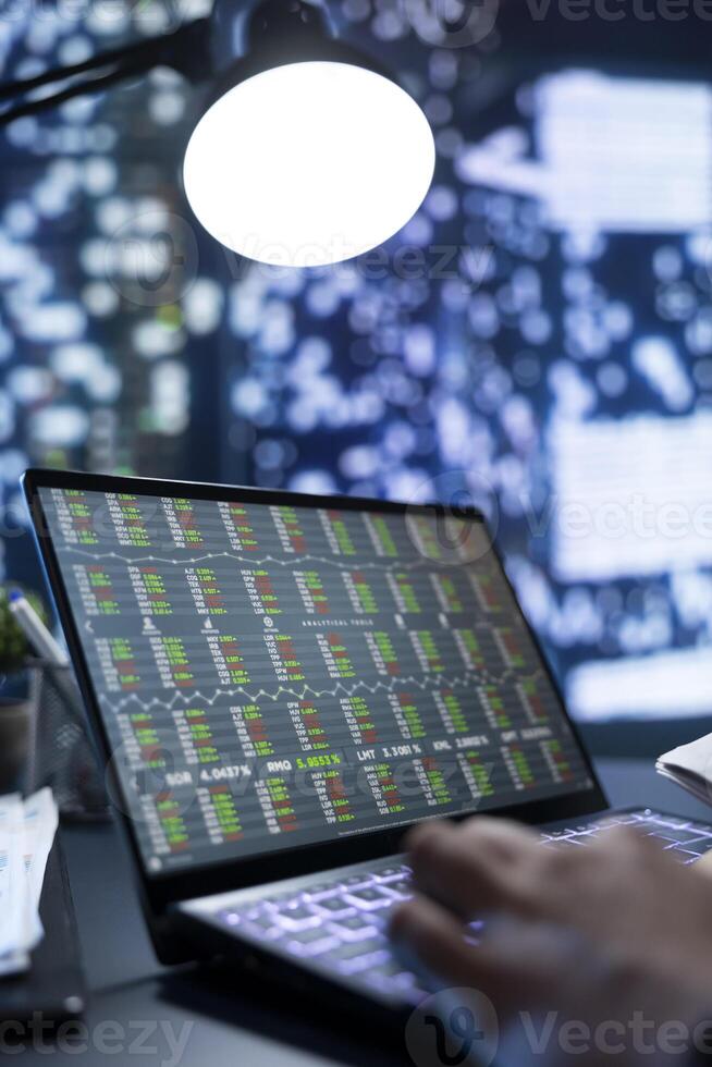 Corporation owner focuses on buying and selling stocks to grow income, examining files with bookkeeping information for constitutional validity. Director monitoring trade shifts. Close up. photo