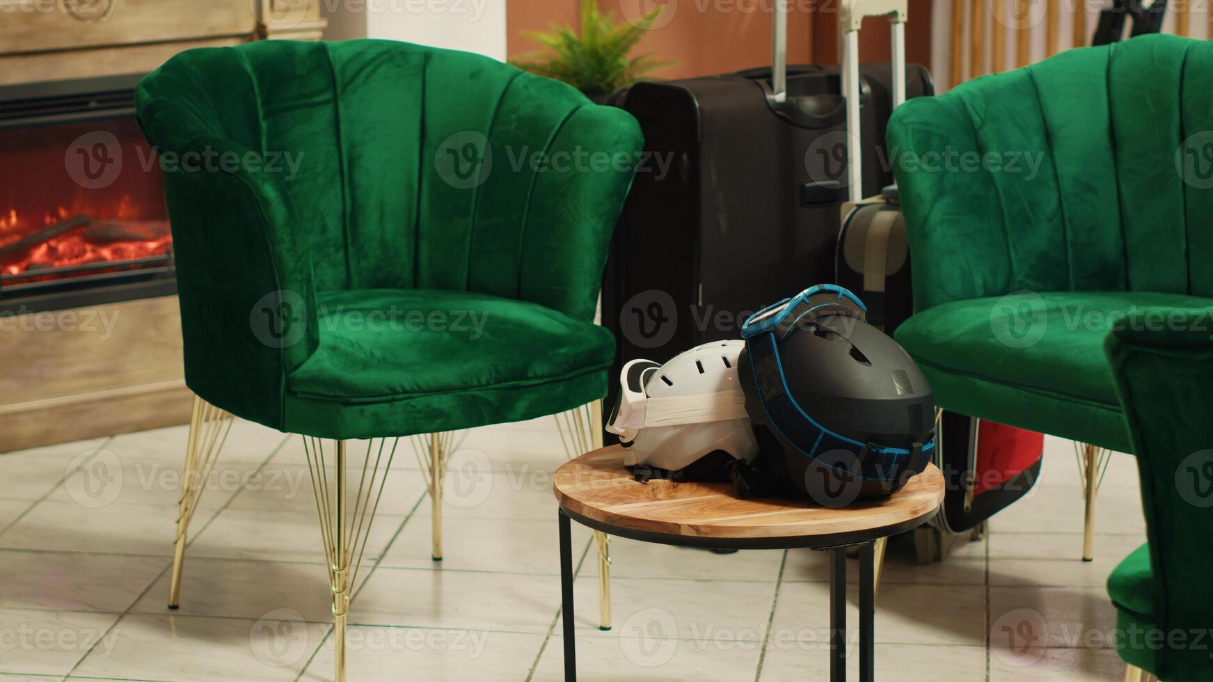 Winter sports fans welcomed in empty lodge reception to use ski slopes during chilly season. Tourists put protective headgear, athletic tools and snowboarding gear in the salon. photo