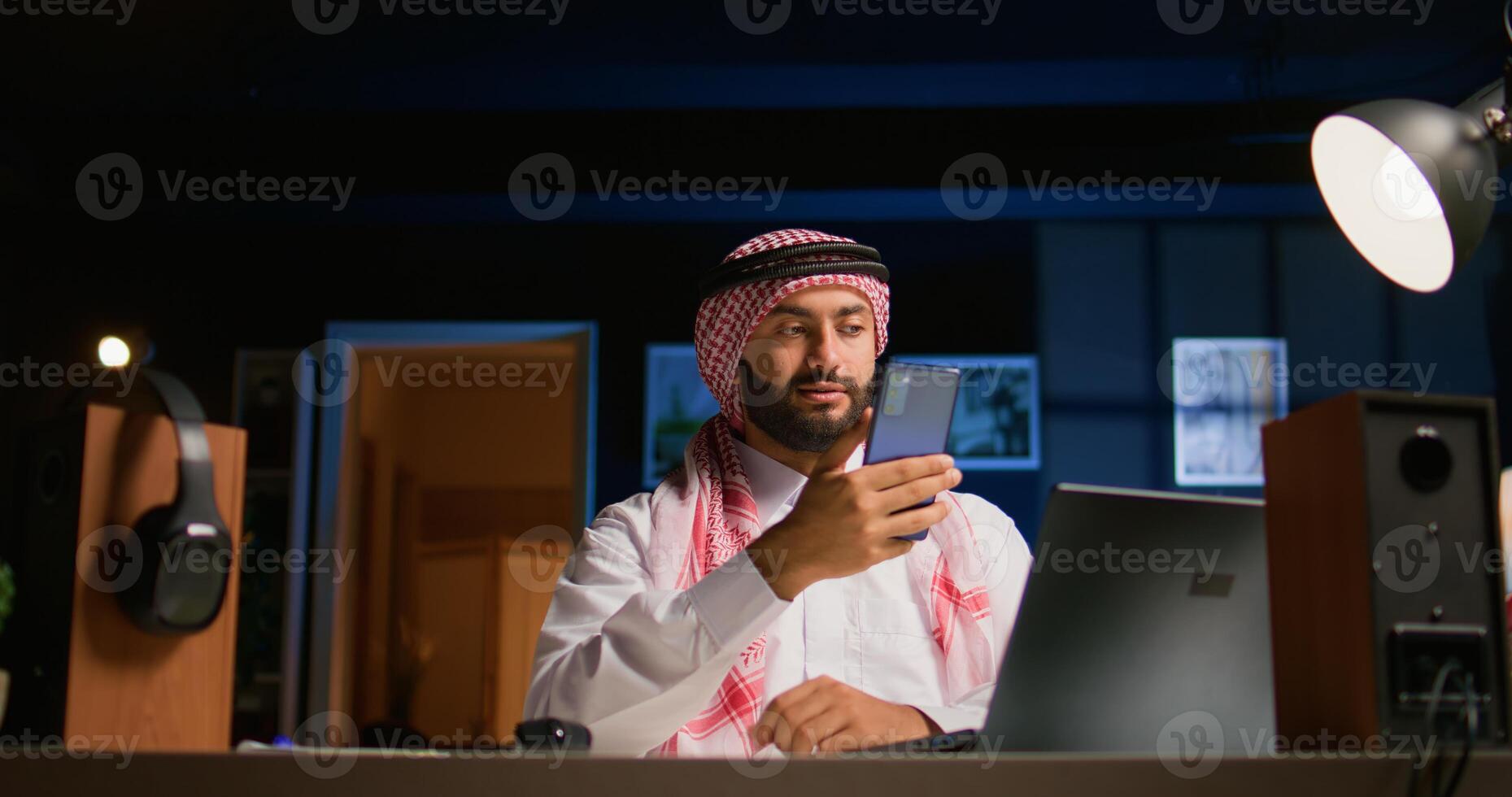 Arab man checking up on close friend during conference meeting over the internet. Middle Eastern person enjoying time together with friend in online call session while at home photo