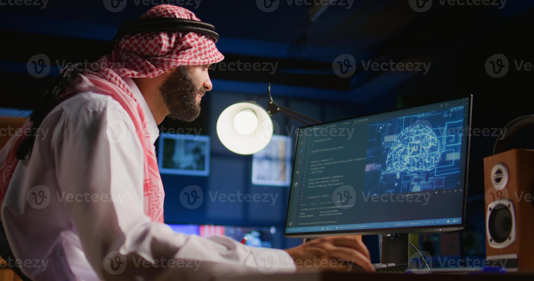 Middle Eastern admin programming AI used for machine learning inference training. Freelancer working from home running code on computer terminal, updating artificial intelligence neural networks photo