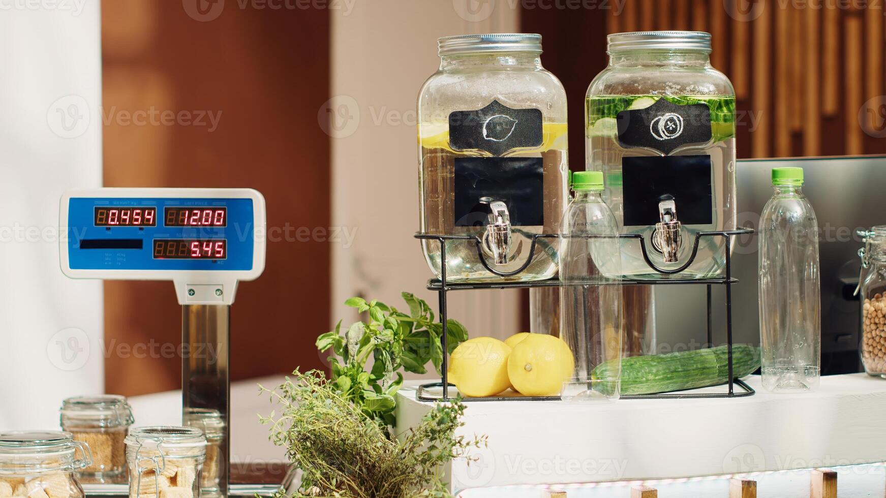 Close up of electronic scale in eco friendly zero waste supermarket next to freshly harvested produce. Panning shot of weighing machine in green living local shop used for bulk products photo