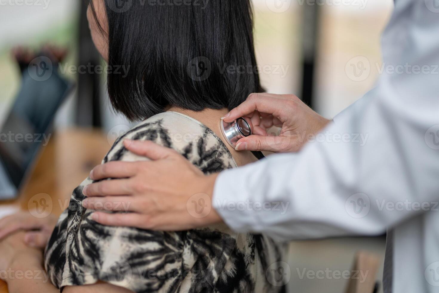Doctor using a stethoscope checking patient with examining, presenting results symptom and recommend treatment method, Healthcare and medical concept photo