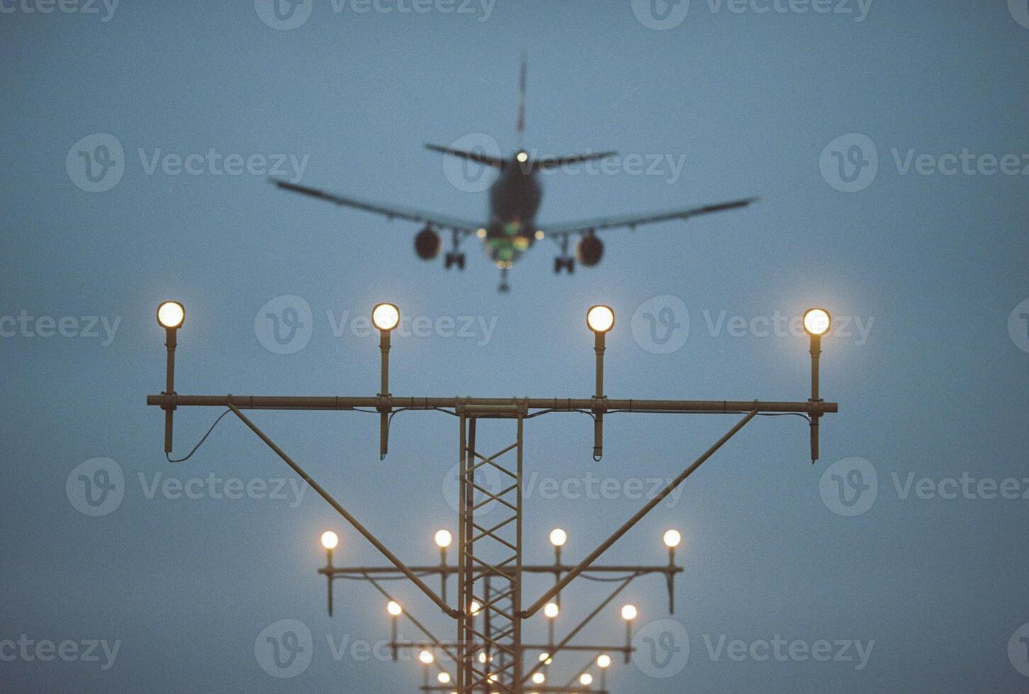Airplane Landing at Twilight with Fog photo
