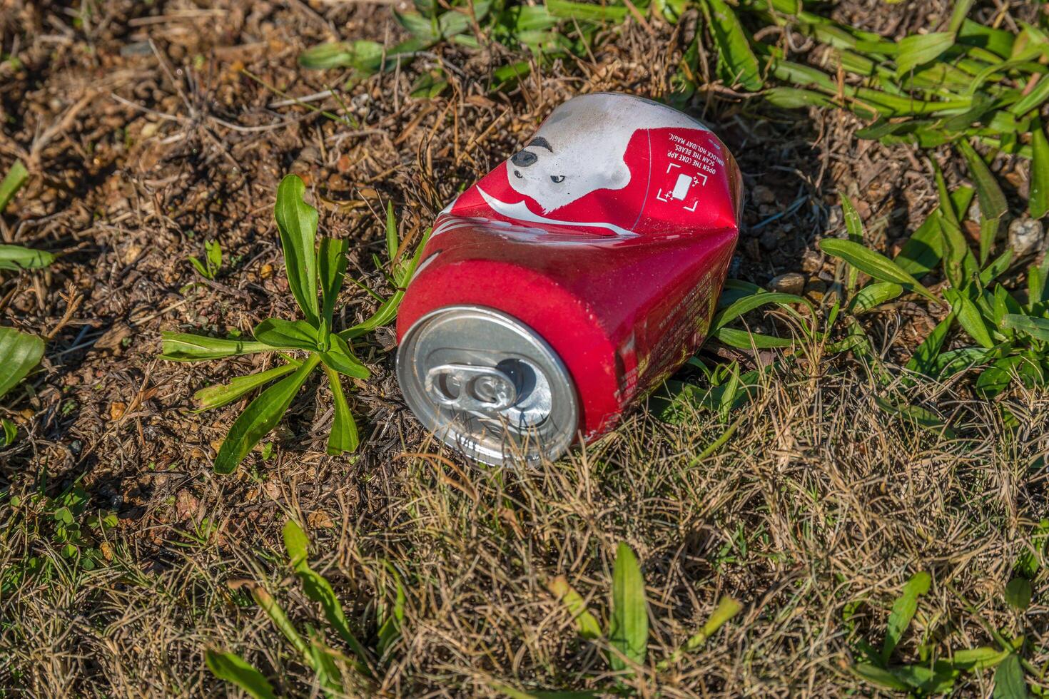 Cumming, Georgia USA - November 17, 2019 Coca-Cola can laying on the ground photo