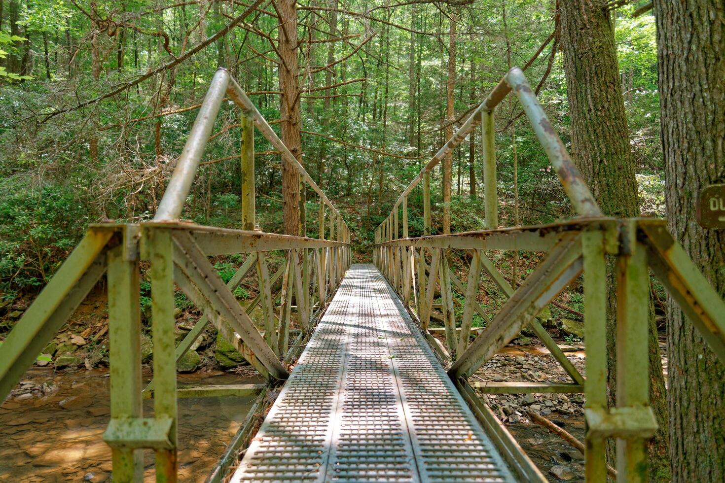 Steel bridge over a creek photo