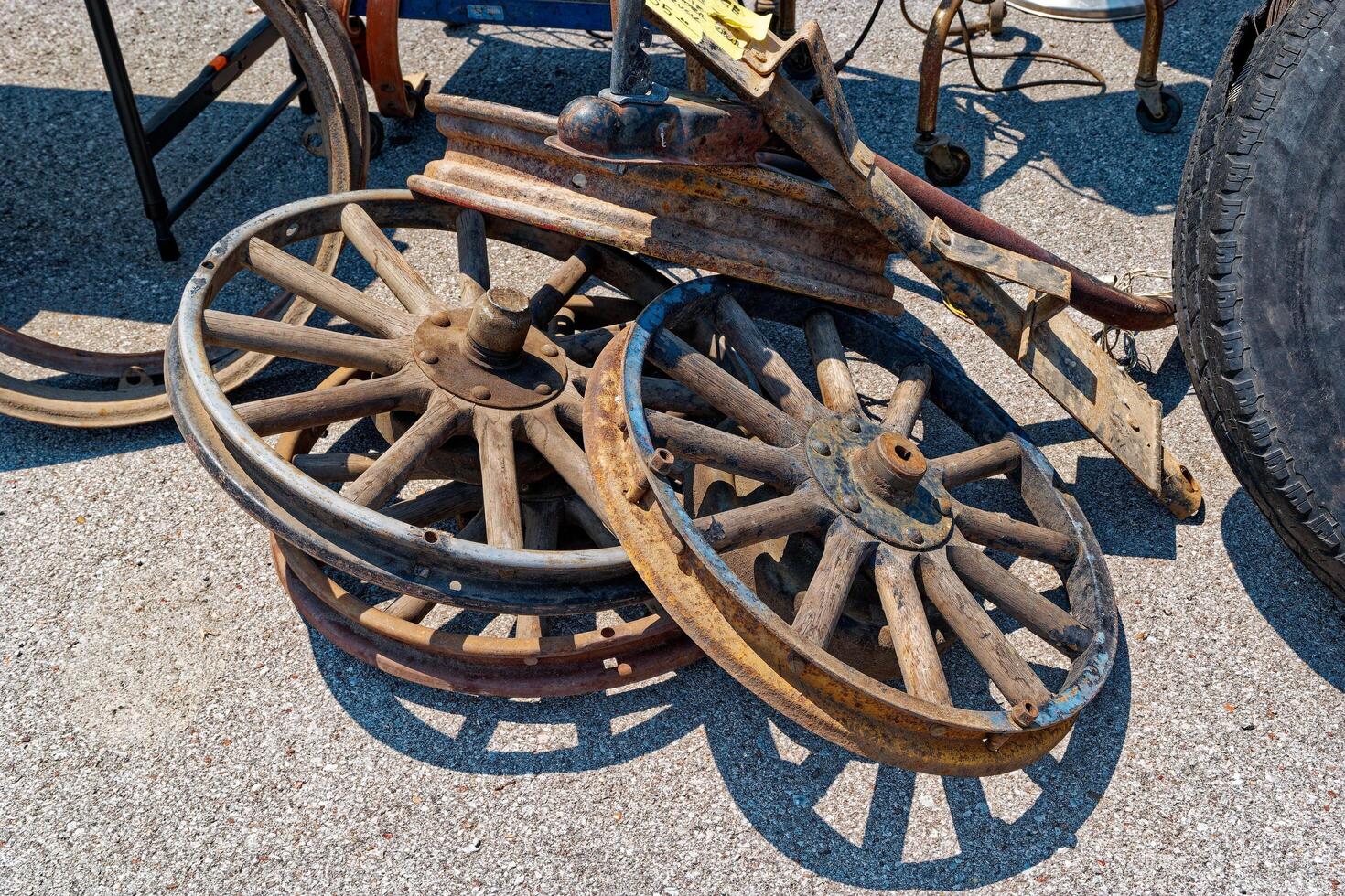 Old wooden Model T or A car wheels closeup view photo