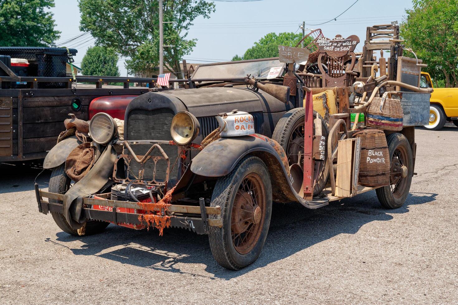 Lebanon, Tennessee USA - June 09, 2023 Hillbilly automobile full of junk at a car show photo