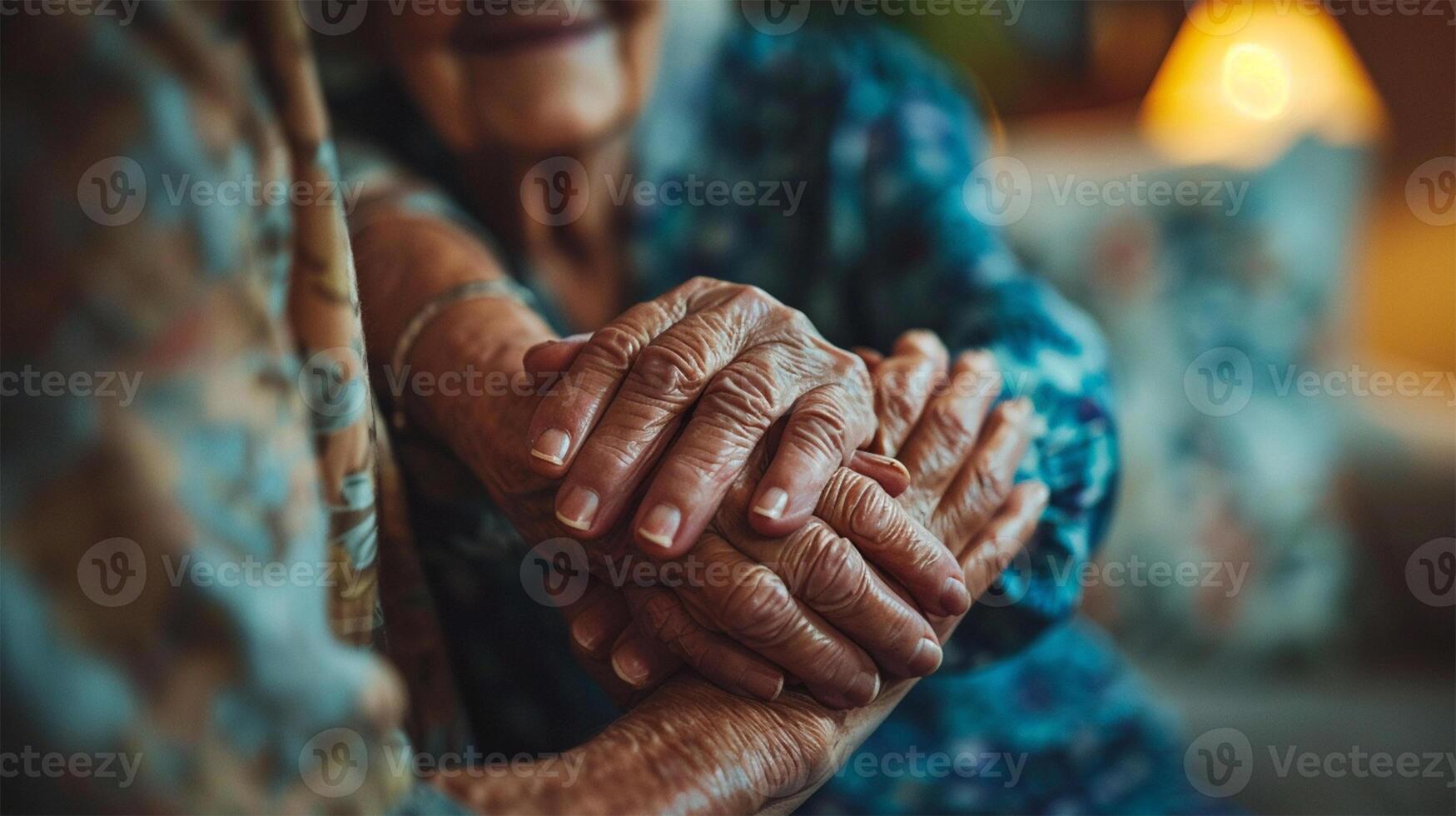 Close-up of seniors holding hands, symbolizing care, support, and affection in a cozy setting. Concept of support and human connection. photo