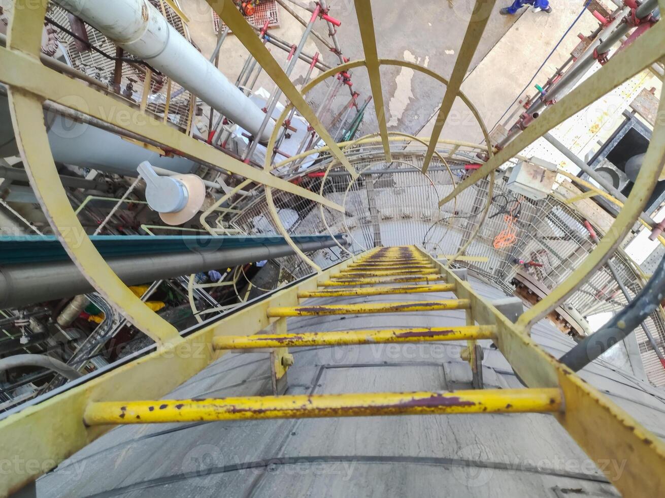 tangga monyet or Monkey ladders or vertical ladders are used to raise high vessels, drums or tanks in industrial factory areas photo
