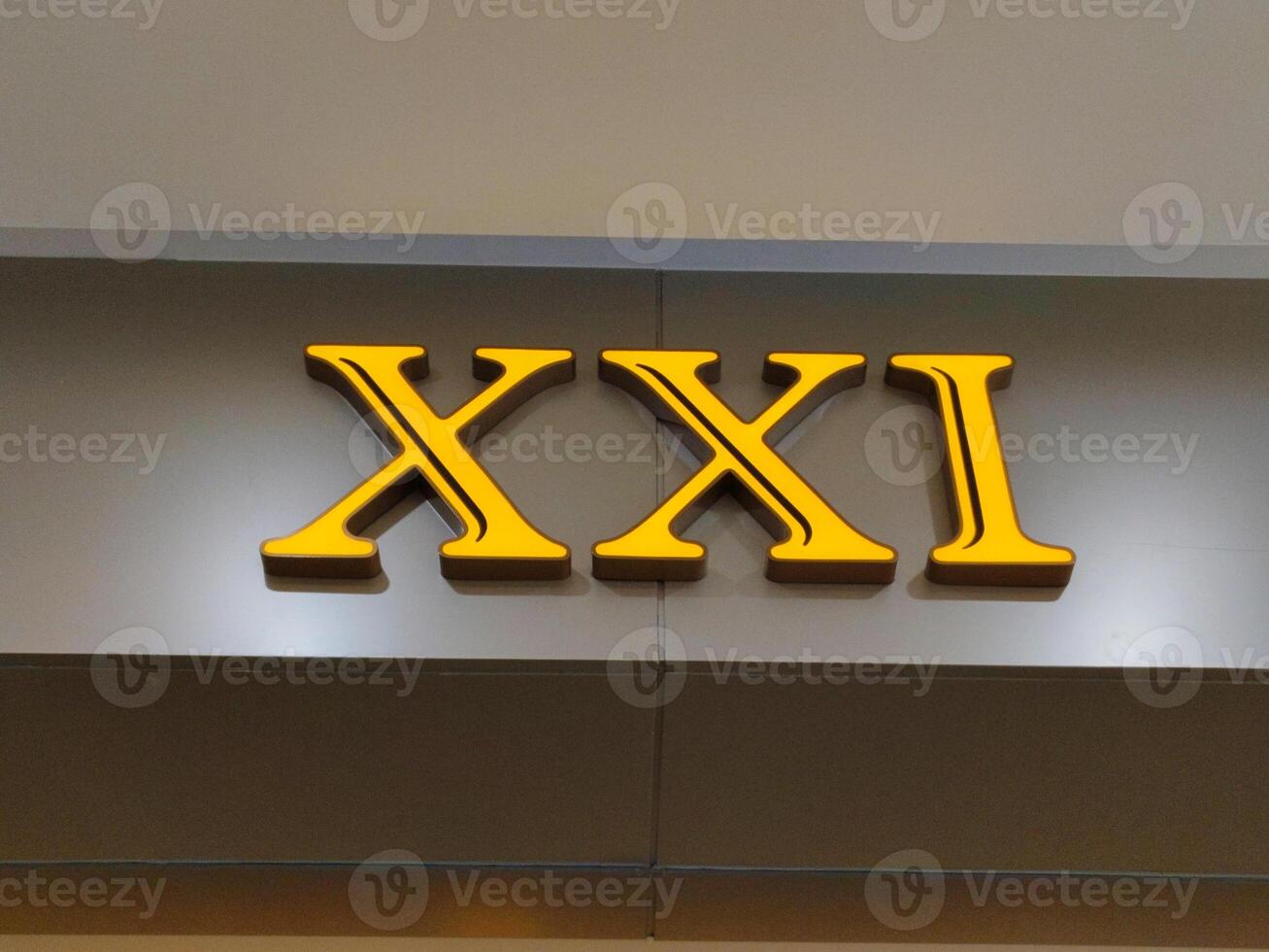 The xxxi sign is displayed on the wall of a building photo